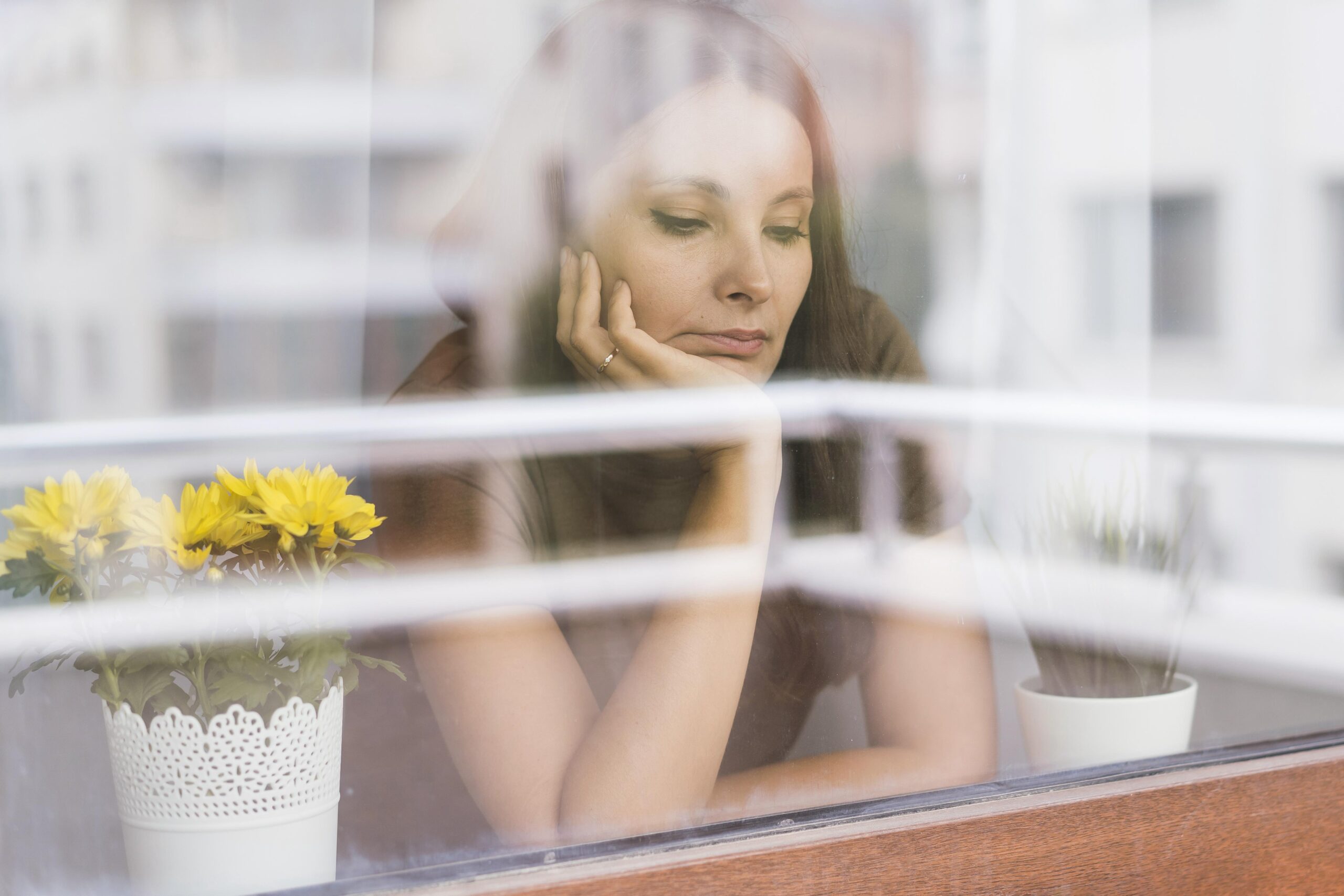 woman-quarantine-looking-through-window