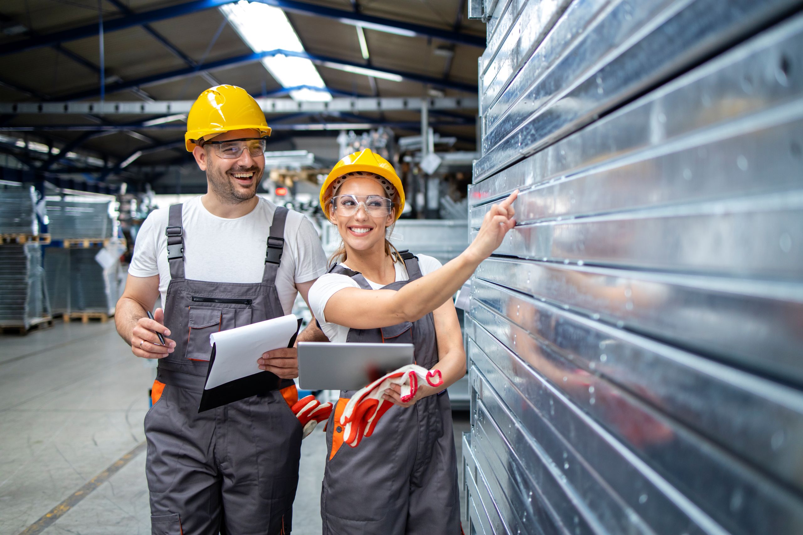 factory-employees-checking-quality-metal-products-production-plant